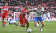 Sontje Hansen of Middlesbrough drives forward under pressure from Conor Shaughnessy of Por...