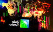In this photo illustration the Aramco logo is shown on a smartphone screen against global...