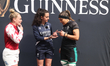 Megan Jones of England's Red Roses, referee Clare Munarini, and Erin King of Ireland are s...