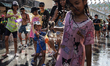 Foreign tourists and Thai revelers participate in the water battle to celebrate the annual...