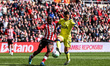 Noah Sadiki of Sunderland and Pedro Porro of Tottenham Hotspur compete for the ball during...