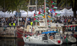 Dozens of vessels depart from the port of Barcelona as part of an international flotilla b...