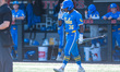 Dean West of the UCLA Bruins heads to the plate during an NCAA baseball game at Bainton Fi...