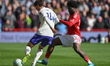 Ola Aina of Nottingham Forest puts pressure on Pau Torres of Aston Villa during the Premie...