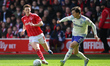 Victor Lindelof of Aston Villa passes the ball under pressure from Elliot Anderson of Nott...