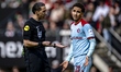 Referee Sedar Gozubuyuk and Feyenoord Rotterdam midfielder Oussama Targhaline are seen dur...