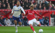 Omari Hutchinson of Nottingham Forest lines up a shot at goal under pressure from Youri Ti...