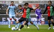 Darko Nejasmic of NEC and Luciano Valente of Feyenoord Rotterdam compete during the Dutch...