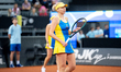 Lyudmyla Kichenok of Ukraine competes in the Billie Jean King Cup Qualifiers, women's doub...