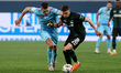 Aleksandr Sobolev (L) of Zenit and Giovanni Gonzalez of Krasnodar vie for the ball during...