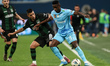 Luiz Henrique (R) of Zenit and Lucas Olaza (2nd L) of Krasnodar vie for the ball during th...