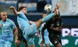 Igor Diveev of Zenit and Jhon Cordoba (R) of Krasnodar vie for the ball during the Russian...