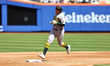 Athletics player Nick Kurtz #16 rounds the bases after hitting a home run during the third...