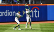 Athletics left fielder Tyler Soderstrom #21 cuts in front of center fielder Denzel Clarke...
