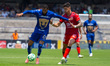 Juninho Vieira #23 of Pumas and Lucas Merolla #19 of Mazatlan compete for the ball during...