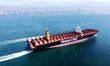 An empty container ship sails towards the open sea in Jiaozhou Bay, Qingdao, Shandong, Chi...