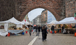 Visitors walk between Italian food stalls at Sendlinger Tor in Munich, Bavaria, Germany, o...