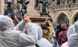 Tourists gather in front of the New Town Hall to watch the Rathaus-Glockenspiel at Marienp...