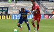 Juninho Vieira #23 of Pumas and Lucas Merolla #19 of Mazatlan compete for the ball during...