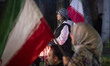 Pro-government supporters carrying national flags participate in a state-run program relat...