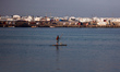 Palestinian fishermen work inside Gaza City's port on April 13, 2026. Both Israel and Hama...