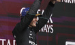 George Russell of the Mercedes AMG F1 Team celebrates on the podium ahead of the Australia...