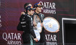 George Russell of the Mercedes AMG F1 Team celebrates on the podium with Andrea Kimi Anton...