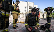 Rescuers work to extinguish a fire in an office building in Zaporizhzhia, Ukraine, on Apri...