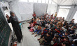 Palestinian students attend lessons in a temporary school in Jabalia refugee camp in the n...