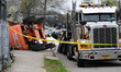 Clifton Police, OSHA, and the Clifton Fire Department work at the scene where a skyboom co...