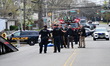 Clifton Police, OSHA, and the Clifton Fire Department work at the scene where a skyboom co...