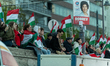 Tisza Party supporters await the results of the parliamentary elections in Budapest, Hunga...
