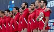 Players from the Georgia water polo national team stand during the playing of their nation...