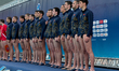 Players from the Montenegro water polo national team stand during the playing of their nat...