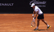 J. Duckworth returns the ball to S. Napolitano in the men's singles final of the ATP Chall...