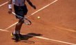 J. Duckworth returns the ball to S. Napolitano in the men's singles final of the ATP Chall...
