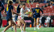 Payton Tini of the Rutgers Scarlet Knights takes a shot during an NCAA women's lacrosse ga...