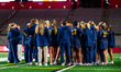 The Michigan Wolverines huddle after an NCAA women's lacrosse game at SHI Stadium in Pisca...