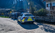 Police officers inspect a van beside a patrol car on a rural road in Schliersee, Bavaria,...