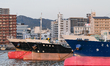 SHUNAN, JAPAN - APRIL 10: 
 A line of industrial transport vessels, including the Dai-ni...