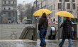 Pedestrians carry umbrellas at Karlsplatz Stachus in Munich, Bavaria, Germany, on April 12...