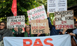 Protesters and members of the La France Insoumise parliamentary group participate in a ral...