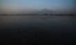 Arjuno volcano is visible from the Lapindo volcanic mudflow area in Sidoarjo, East Java pr...