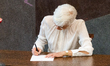 Charlotte Green of the Conservative People's Party attends the signing ceremony for new me...