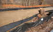 Water floods the Etobicoke Creek in downtown Brampton, Ontario, on April 14, 2026, after a...