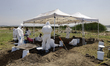 Experts from the Attorney General's Office of Mexico City search for human bone fragments...