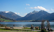 People walk and relax along the shore of Lake Schliersee in Schliersee, Bavaria, Germany,...