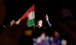 Members of Hungary's ruling party Tisza celebrate their landslide win in the Hungarian nat...