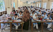 Students arrive to sit for the Primary School Scholarship Examination at Segunbagicha High...
