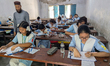 Students arrive to sit for the Primary School Scholarship Examination at Segunbagicha High...